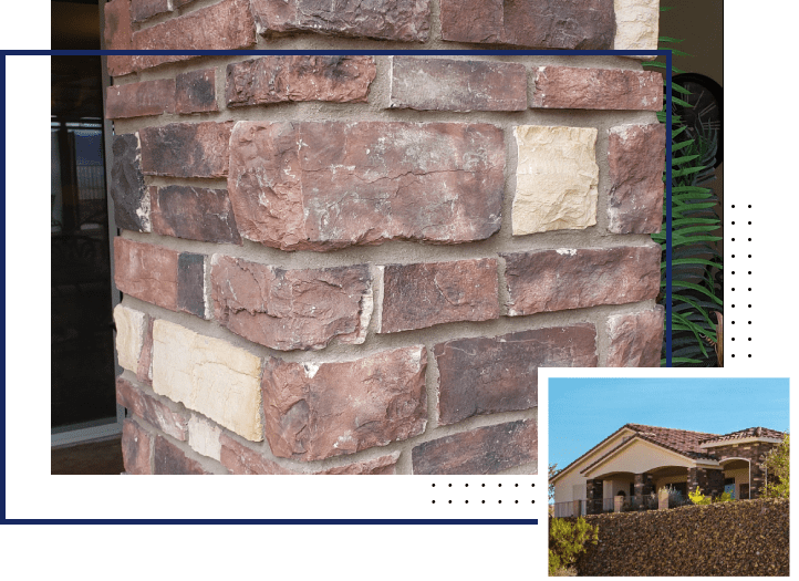 A brick wall with a house in the background.